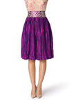 Knee-length pleated purple skirt