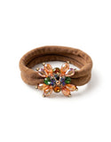 Brown velvet hairband with a colorful jeweled flower clip on a white background